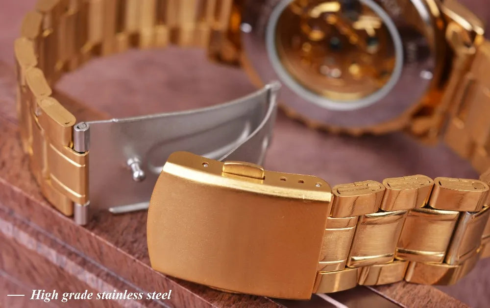 Gold-toned Winner mechanical sport design bezel watch bracelet with polished interlocking links and rectangular buckle.