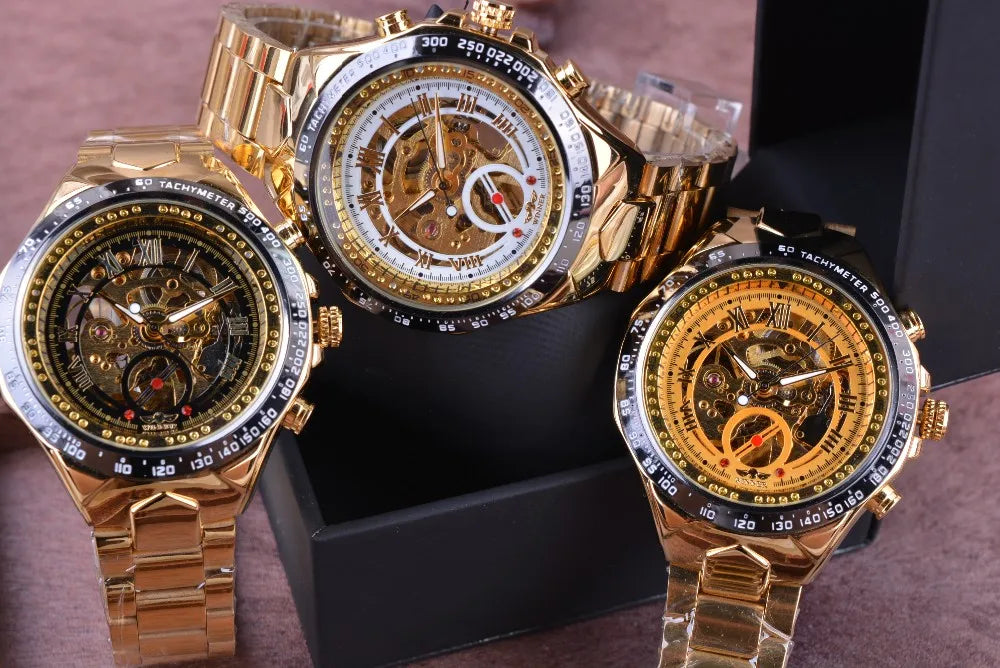 Three gold-toned Winner mechanical sport skeleton chronograph watches with exposed movements and Roman numerals.