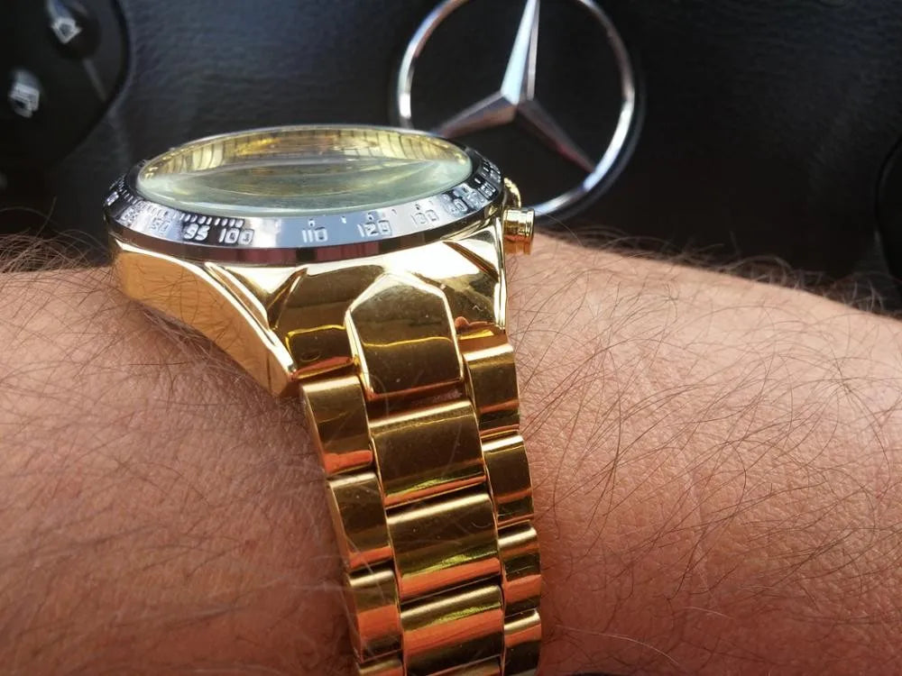 Winner Mechanical Sport gold-tone chronograph watch on wrist