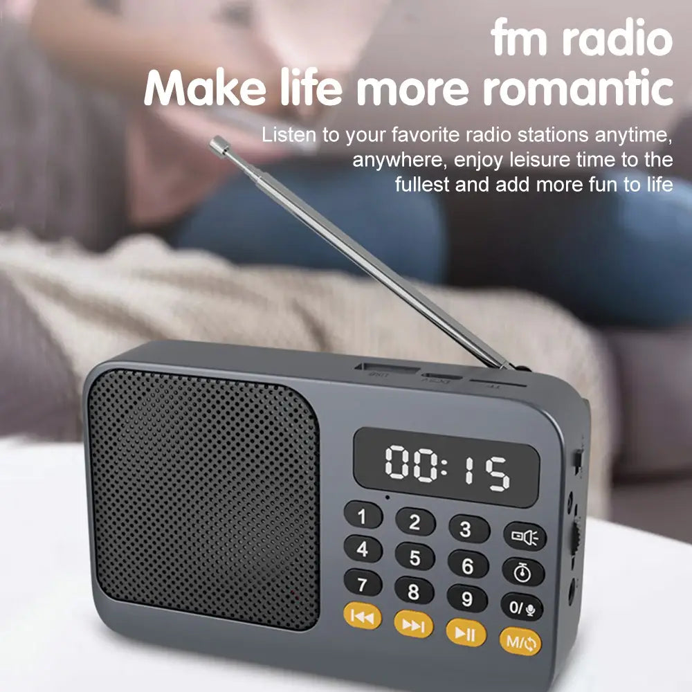 Gray portable radio music player with telescopic antenna and LED display
