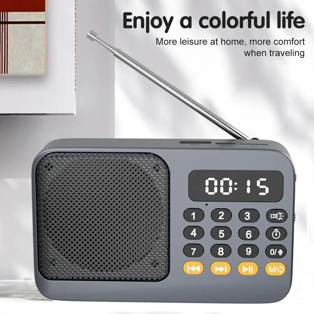 Gray portable radio music player with telescopic antenna and LED display
